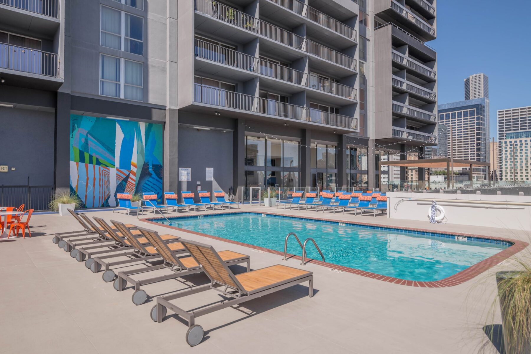 Pool with deck chairs and covered pavilion