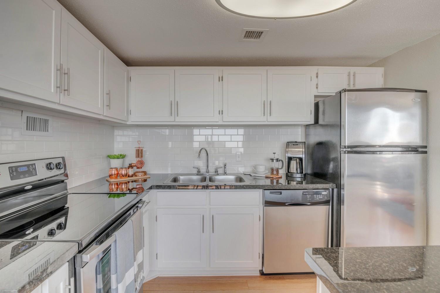 Kitchen with granite counters and stainless steel appliances