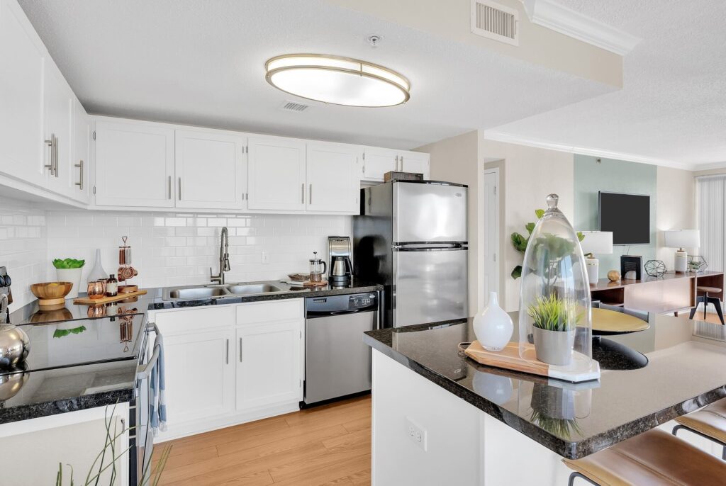 Luxury kitchen with granite counters at Houston House Downtown Houston apartments